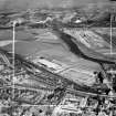 Glasgow, general view, showing Hoover (Electric Motors) Ltd. Cambuslang Works, Somervell Street and Bogeshole Road Bridge.  Oblique aerial photograph taken facing north.  This image has been produced from a crop marked negative.