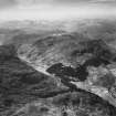 Carn a' Mhadaidh-ruaidh and Gleann Chorainn, Strathconon Forest.  Oblique aerial photograph taken facing west.