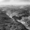 Carn a' Mhadaidh-ruaidh and Gleann Chorainn, Strathconon Forest.  Oblique aerial photograph taken facing west.