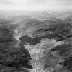 Carn a' Mhadaidh-ruaidh and Gleann Chorainn, Strathconon Forest.  Oblique aerial photograph taken facing west.