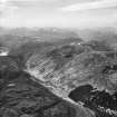 Gleann Chorainn and Loch Toll Lochain, Strathconon Forest.  Oblique aerial photograph taken facing west.