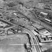 Stewarts and Lloyds Ltd. Works, Main Street, Coatbridge.  Oblique aerial photograph taken facing south-east.  This image has been produced from a crop marked negative.