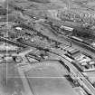 Stewarts and Lloyds Ltd. Works, Main Street, Coatbridge.  Oblique aerial photograph taken facing south-east.  This image has been produced from a crop marked negative.