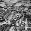 Barrhead, general view, showing West Arthurlie Bleach Works, Kelburn Street and Kirkton Avenue.  Oblique aerial photograph taken facing south-west.  This image has been produced from a crop marked negative.