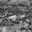 Paisley, general view, showing Scottish Wool Growers Ltd. Underwood Wool Stores, Brown Street and John Neilson Institution, Oakshaw Road.  Oblique aerial photograph taken facing north-east.  This image has been produced from a crop marked negative.