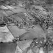 Denny, general view, showing Cruikshank and Co. Ltd. Denny Iron Works, Glasgow Road and Dryburgh Avenue.  Oblique aerial photograph taken facing west.  This image has been produced from a crop marked negative.
