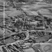 Bonnybridge Gasworks and Smith and Wellstood Ltd. Columbian Stove Works, Bonnybridge.  Oblique aerial photograph taken facing south-east.  This image has been produced from a crop marked negative.