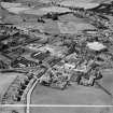 Bonnybridge Gasworks and Smith and Wellstood Ltd. Columbian Stove Works, Bonnybridge.  Oblique aerial photograph taken facing north-west.  This image has been produced from a crop marked negative.