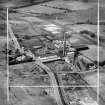Robert Craig and Sons Ltd. Caldercruix Paper Mills, Airdrie Road, Caldercruix.  Oblique aerial photograph taken facing north-west.  This image has been produced from a crop marked negative.