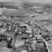 Caldercruix, general view, showing Robert Craig and Sons Ltd. Caldercruix Paper Mills, Airdrie Road and Hillend Reservoir.  Oblique aerial photograph taken facing east.