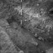 Cairnpapple Hill,  photograph of excavation showing henge ditch on W side.