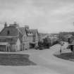 General view of main street, Carrbridge, showing the hotel, garage and deck of road bridge
A Brown & Co. Lanark