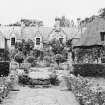 Postcard view of Barony House and garden.