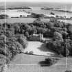 Dunninald Castle, Montrose.  Oblique aerial photograph taken facing east.  This image has been produced from a crop marked negative.