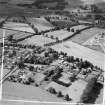 Moffat, general view, showing Warriston School Holmpark, Ballplay Road and Moffat Station.  Oblique aerial photograph taken facing west.  This image has been produced from a crop marked negative.