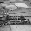 Ladysbridge Hospital and Ladysbridge Station, Boyndie.  Oblique aerial photograph taken facing south.  This image has been produced from a crop marked negative.