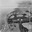 Lathallan School and Johnshaven.  Oblique aerial photograph taken facing south-west.  This image has been produced from a crop marked negative.