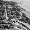 Carnoustie, general view, showing Station Hotel, Station Road and Tayside Street.  Oblique aerial photograph taken facing east.  This image has been produced from a crop marked negative.