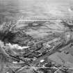 New Stevenston, general view, showing Stewarts and Lloyds Ltd. Clydesdale Steel and Tube Works, Clydesdale Street and St Patrick's Cemetery.  Oblique aerial photograph taken facing south-east.  This image has been produced from a crop marked negative.