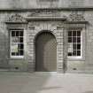 Courtyard. W range. View of doorway with flanking windows