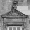 N facade. Detail showing pediment with "GH" in tympanum