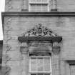 N facade. Detail showing carved pediment