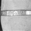 Detail of gold finger ring marked with the Amsterdam arms, the letters "P", DR" and a lion rampant. The maker has not been identified. Scale in millimetres.