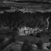 Glamis Castle and Estate.  Oblique aerial photograph taken facing north.  This image has been produced from a print.