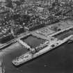 Rothesay, general view, showing Rothesay Harbour and Castle, Isle of Bute.  Oblique aerial photograph taken facing south-west.  This image has been produced from a print.