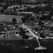 Luss, general view, showing Luss Pier, Loch Lomond and Colquhoun Arms Hotel.  Oblique aerial photograph taken facing south-west.  This image has been produced from a print.