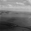 Forth Rail Bridge and Inchcolm, Firth of Forth.  Oblique aerial photograph taken facing east.  This image has been produced from a print.