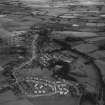 Lennoxtown, general view, showing J and W Somerville Ltd. Kali Nail Works, Station Road and Main Street.  Oblique aerial photograph taken facing south-east.  This image has been produced from a print.