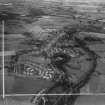 Lennoxtown, general view, showing J and W Somerville Ltd. Kali Nail Works, Station Road and Main Street.  Oblique aerial photograph taken facing south-east.  This image has been produced from a crop marked print.