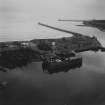 Dry Dock, Pocra Quay and North Pier, Aberdeen Harbour.  Oblique aerial photograph taken facing east.  This image has been produced from a print.