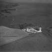 Todhead Lighthouse, Todhead Point.  Oblique aerial photograph taken facing north-east.  This image has been produced from a print.