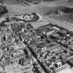 Edinburgh, general view, showing William Younger and Co. Ltd. Holyrood Brewery and Palace of Holyroodhouse.  Oblique aerial photograph taken facing east.  This image has been produced from a crop marked print.