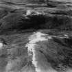 Hindhope Hill Hillfort and Loddan Hill, Cheviot Hills.  Oblique aerial photograph taken facing west.  This image has been produced from a print.