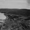 Campbeltown, general view, showing Kilkerran Road and Beinn Ghuilean.  Oblique aerial photograph taken facing south-east.  This image has been produced from a print.