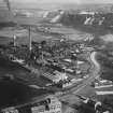 Oil Works, Broxburn. Oblique aerial photograph taken facing north-east.  This image has been produced from a print.
