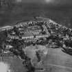 Ardbeg, general view, showing Ardbeg Point and High Road.  Oblique aerial photograph taken facing north-east.  This image has been produced from a print.