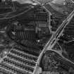 William Younger and Co. Ltd. Moray Park Maltings and Miller and Co. London Road Foundry, Edinburgh.  Oblique aerial photograph taken facing east.  This image has been produced from a marked print.