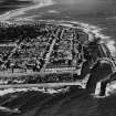 Lossiemouth, general view, showing Lossiemouth Harbour and Queen Street.  Oblique aerial photograph taken facing west.  This image has been produced from a print. 