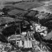 Alexander Cowan and Sons Valleyfield Paper Mill, Valleyfield Road, Penicuik.  Oblique aerial photograph taken facing east.  This image has been produced from a print.