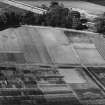 Dobbie and Co. Melville Nurseries, Gilmerton Road, Edinburgh.  Oblique aerial photograph taken facing north.  This image has been produced from a print.