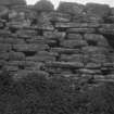 Detail of internal wall face, probably at E end of later rectangular building. Dun an Sticer.