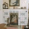 Interior. Detail of boudoir showing delft tile fireplace with grate and fender