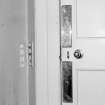 Interior. Detail of dining room door fittings and light switches