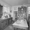 Interior. View of kitchen from S showing original cabinets