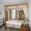 Interior. View of first floor bedroom, former dressing room from N