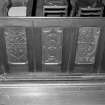 Pews, carved panels, detail